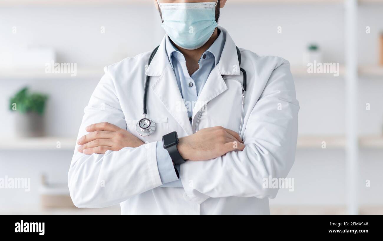 COVID-19 outbreak and work of medical staff in modern clinic Stock Photo