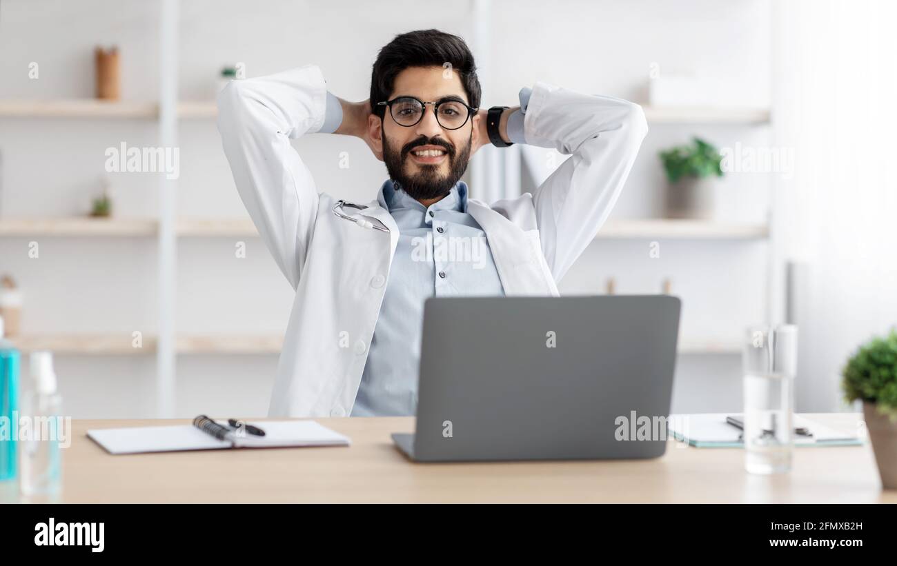 Rest and relax during break, medical worker with gadgets Stock Photo