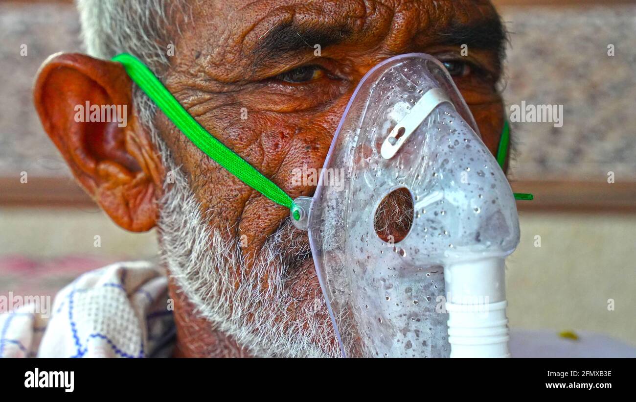 02 May 2021- Reengus, Sikar, India. Selective focus on Oxygen mask or inhalation Cannula with liquid Oxygen supply. Liquid breathing mask closeup shot Stock Photo