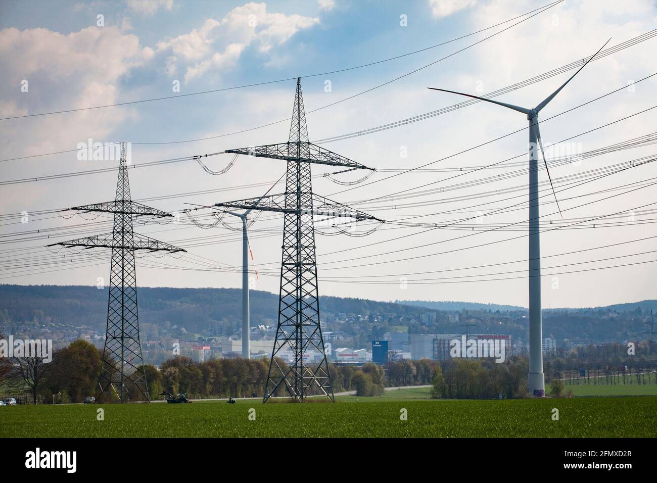 high voltage pylons and wind turbines near Dortmund-Eichlinghofen, Dortmund, North Rhine-Westphalia, Germany.  Hochspannungsmasten und Windraeder bei Stock Photo