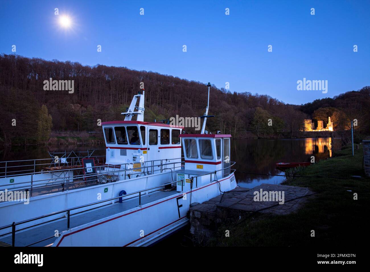 ferry boats lying on the banks of the Ruhr River in Witten-Heven, in the background the ruins of Hardenstein Castle in Muttental Valley, Witten, North Stock Photo