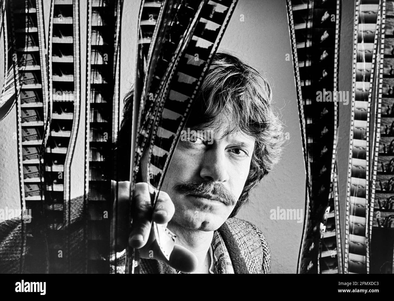 Turkish-born director Tevfik Baser behind filmstrips. Baser is the director of the successful 1985 film '40 Square Meter Deutschland'. 13.02.1987 - Ch Stock Photo