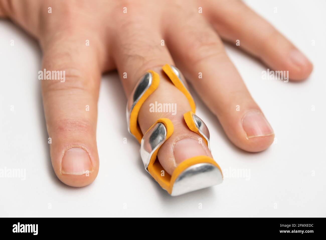 broken finger in splint isolated white background Stock Photo Alamy