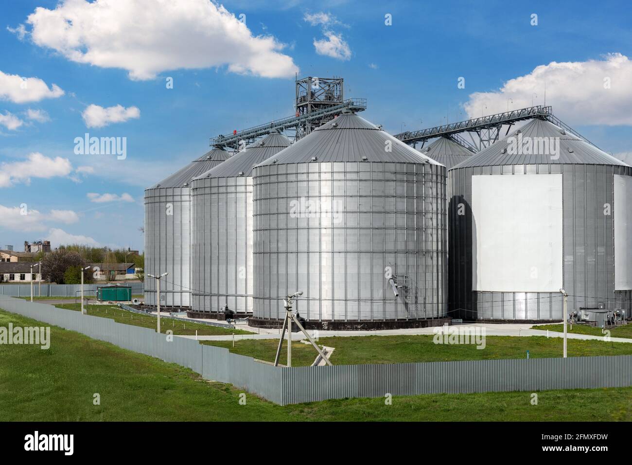 Scenic view of big modern steel agricultural grain granary silos cereal