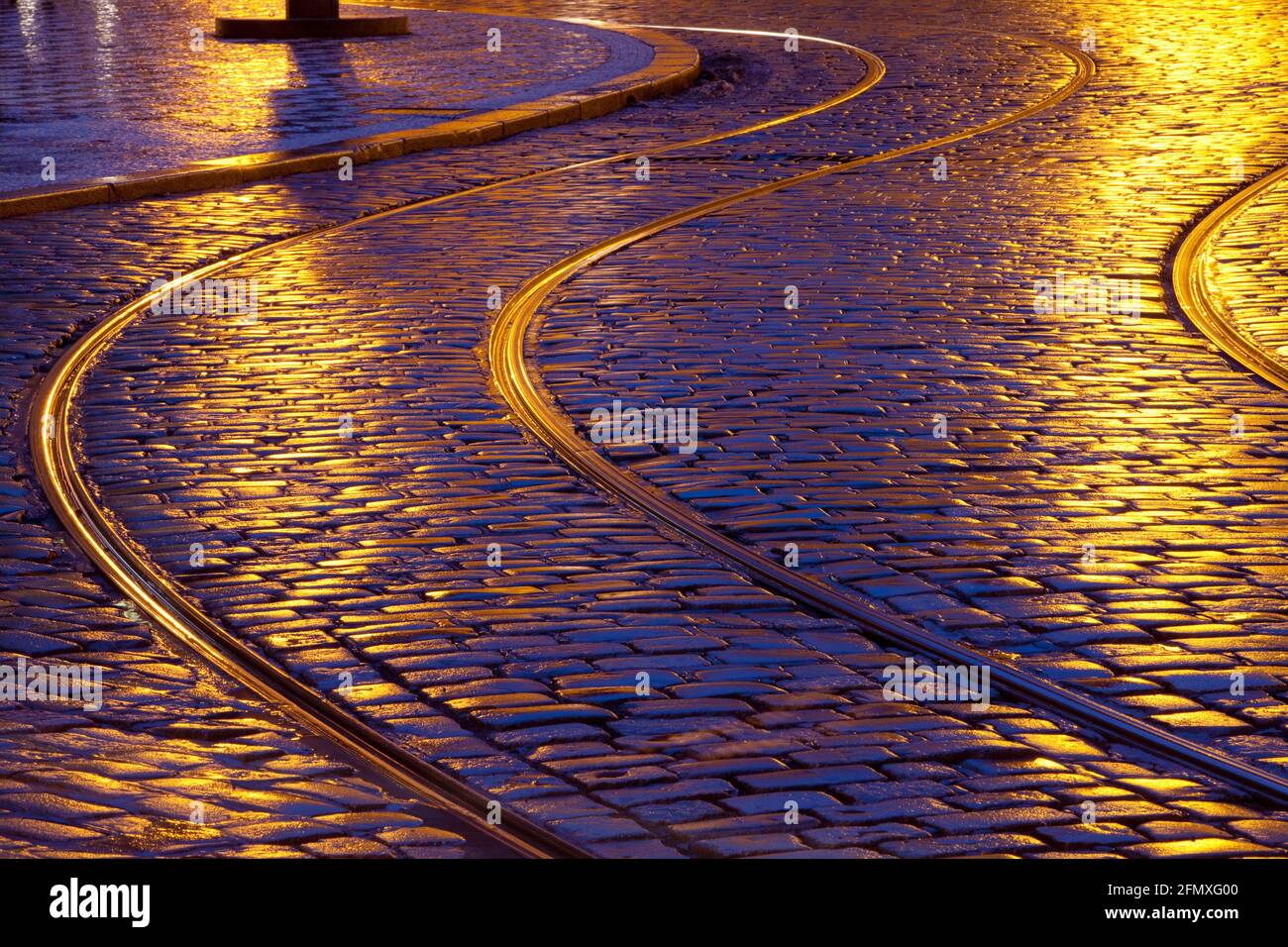 Prague streets with cobblestones and streetcar rails. Stock Photo