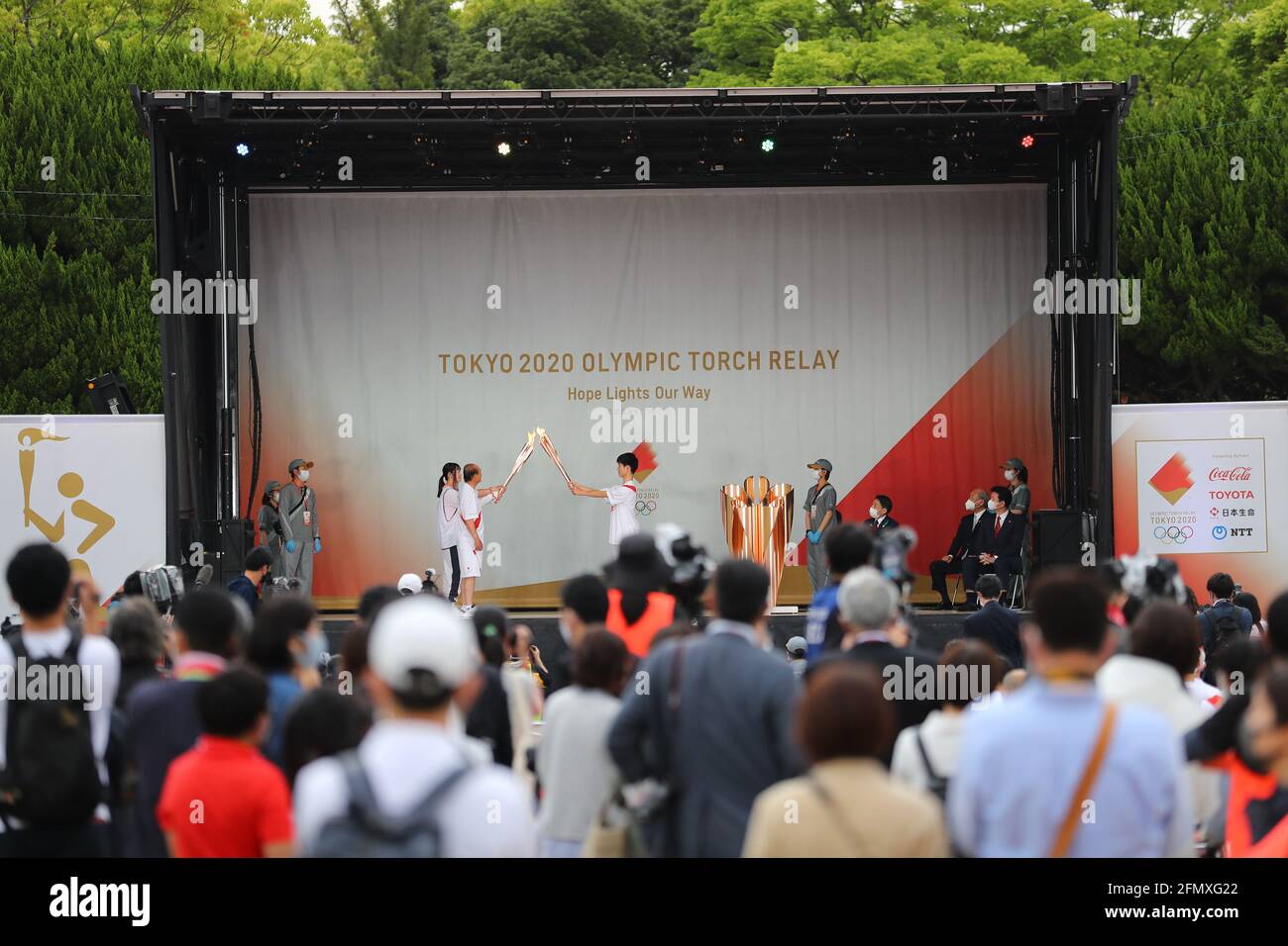 (210512) -- FUKUOKA, May 12, 2021 (Xinhua) -- An ignition ceremony for the Tokyo Olympic torch relay is held at Heiwadai Athletic Stadium in Fukuoka, southwestern Japan, May 11, 2021. The torch relay was taken off public roads and replaced by ignition ceremony due to the coronavirus pandemic. (Tokyo2020/Handout via Xinhua) Stock Photo