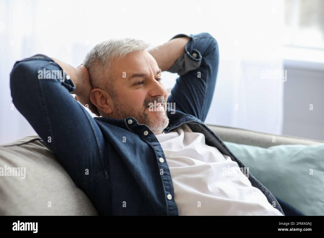 Bearded senior man sitting on hi-res stock photography and images - Alamy