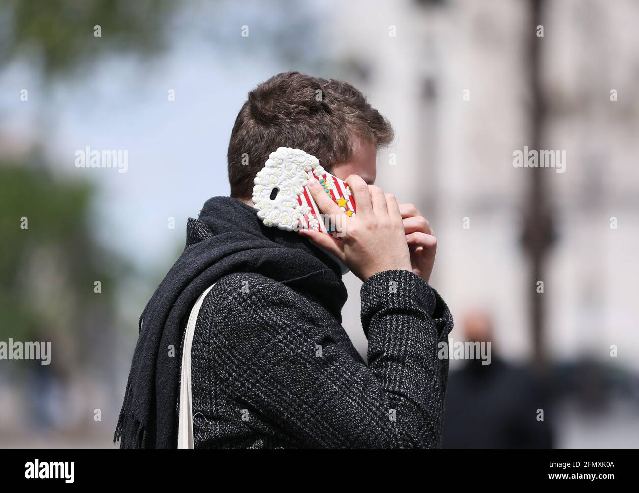 PARIS, May 12, 2021 (Xinhua) -- A man makes a phone call near the Arc de Triomphe in Paris, France, May 12, 2021. France is on its way to coming out of the health crisis as COVID-19 indicators continue the downward trend and vaccine rollout is speeding up, according to French Prime Minister Jean Castex. (Xinhua/Gao Jing) Stock Photo