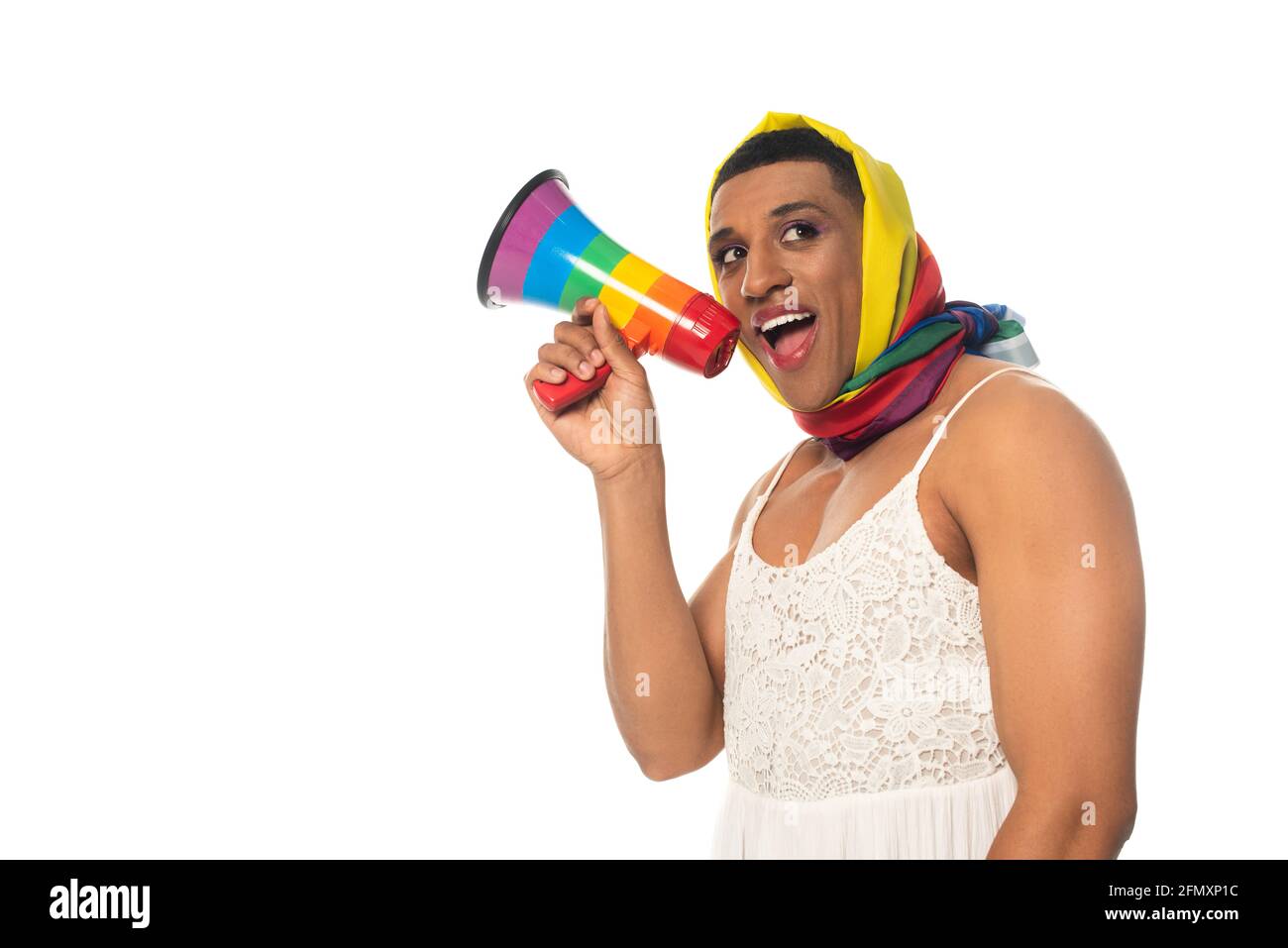 african american transvestite man in rainbow colors head kerchief screaming in megaphone isolated on white Stock Photo