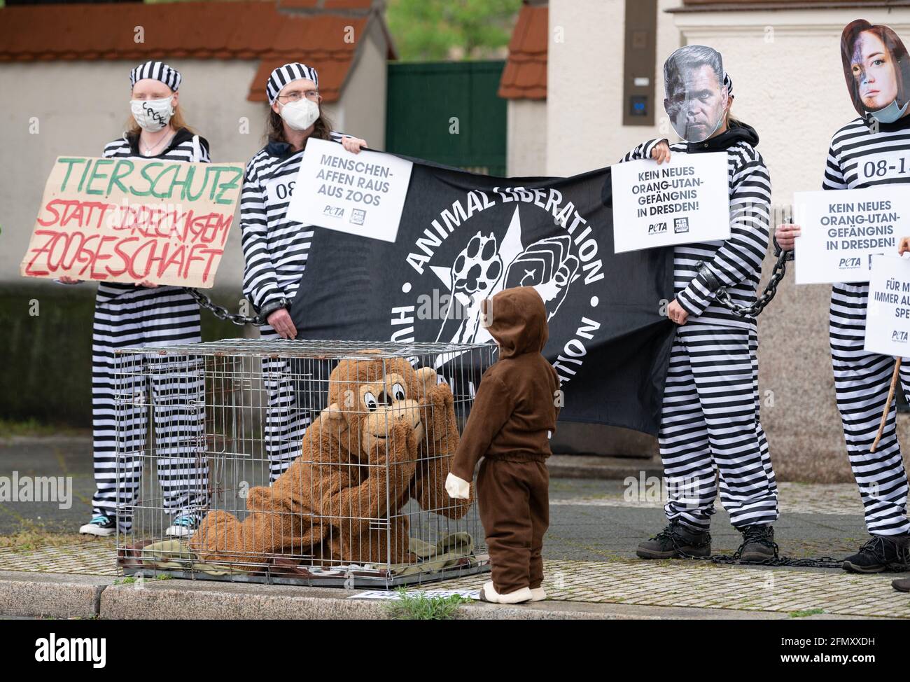 Dresden, Germany. 12th May, 2021. Participants of a demonstration of the  animal rights organization Peta stand on the sidelines of a city council  meeting at the exhibition grounds. The city council wants