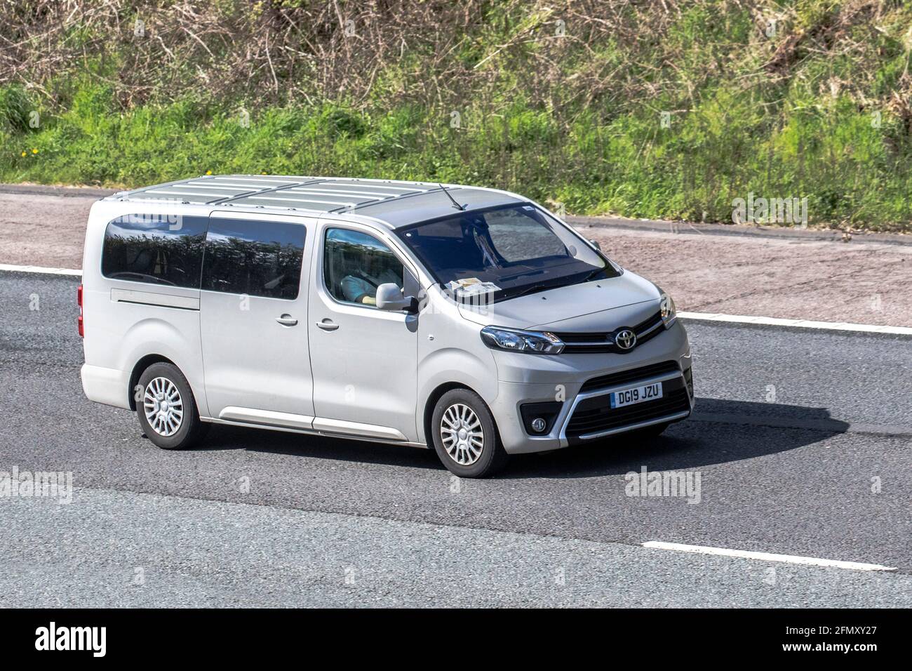 2019 silver Toyota Proace Verso Shuttle L2 D-4D Medium People Carrier; Vehicular traffic, moving vehicles, cars, vehicle driving on UK roads, motors, motoring on the M6 motorway highway UK road network. Stock Photo