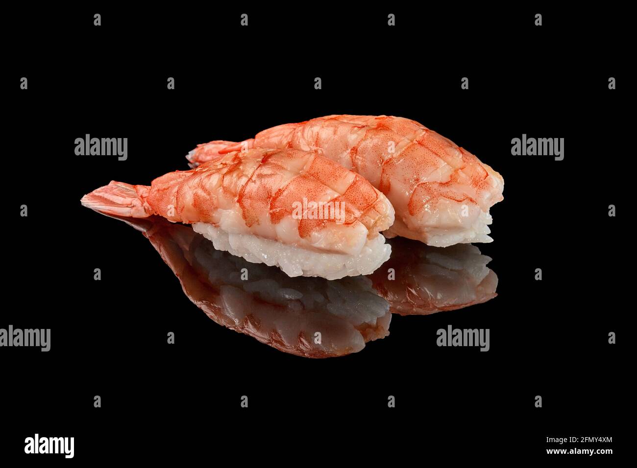 Two shrimp nigiri sushi on black background with reflection Stock Photo