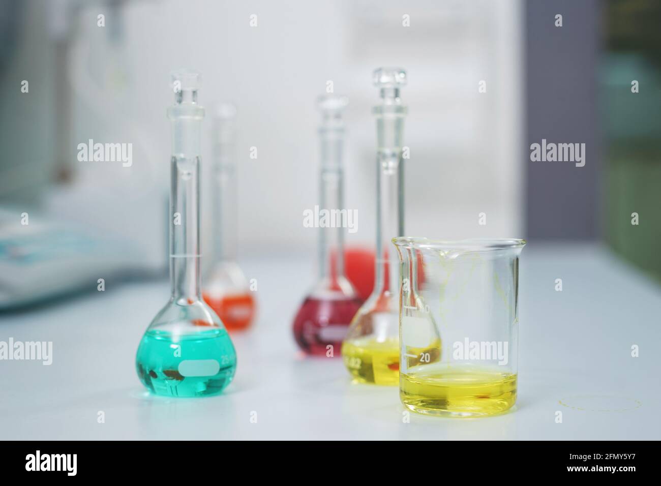 Test tubes and flasks with test liquid on the table in a chemical lab ...