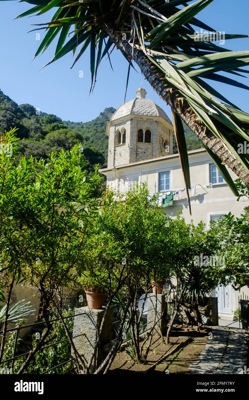 View of the San Fruttuoso abbey, a remote cloister in a hidden bay in Liguria. It is surrounded by trees. Stock Photo