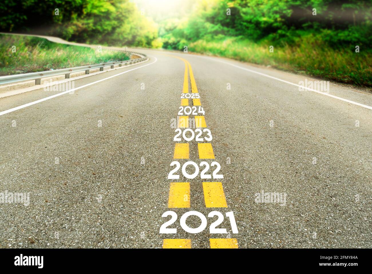 Road with years 2021 to 2025, go ahead Stock Photo - Alamy