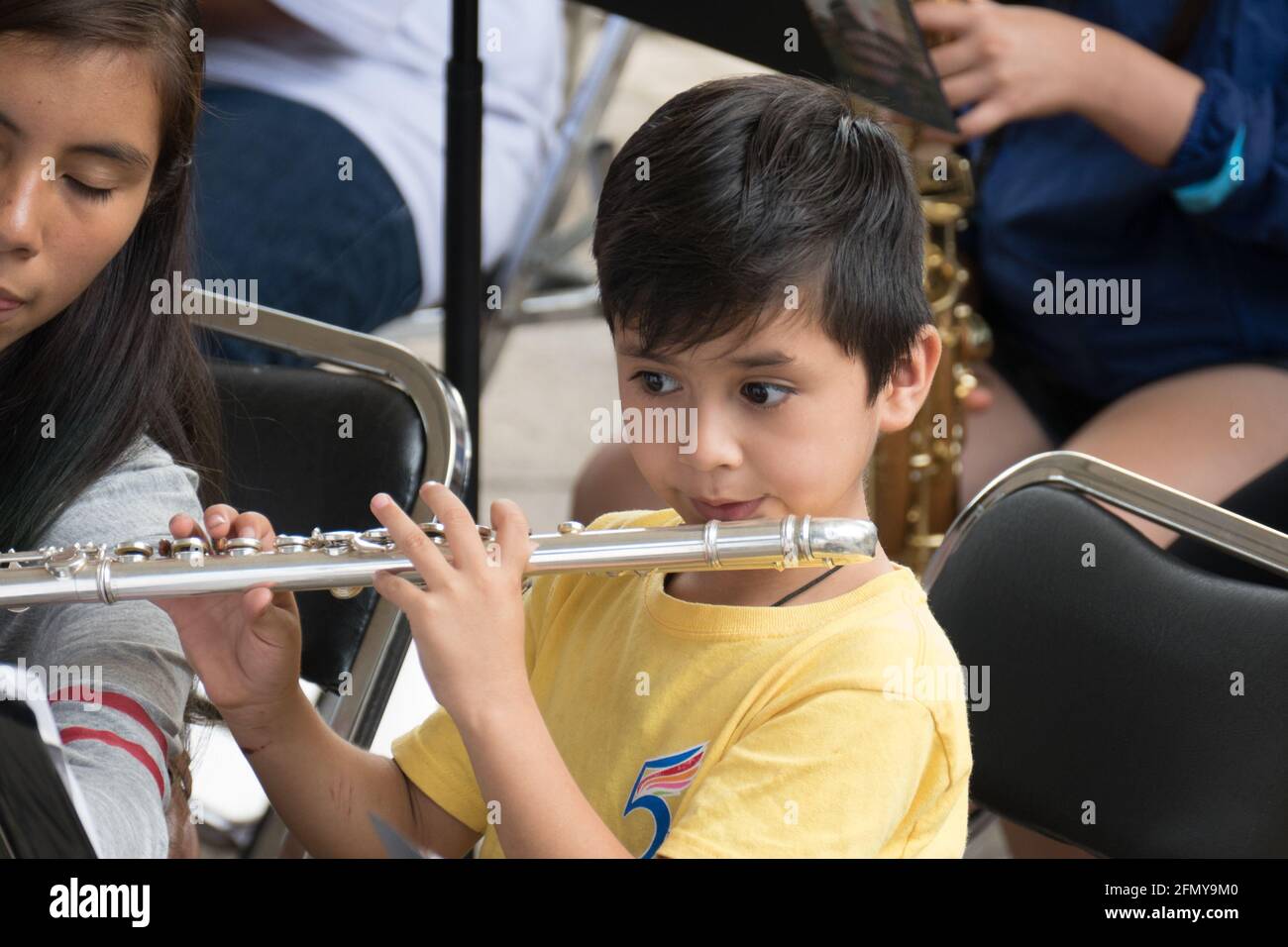 Boy playing transverse flute in symphony orchestra Stock Photo Alamy
