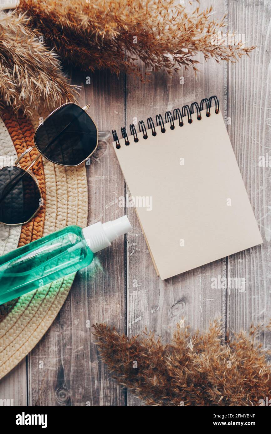 summer hat, glasses and suntan lotion. summer and tourism concept