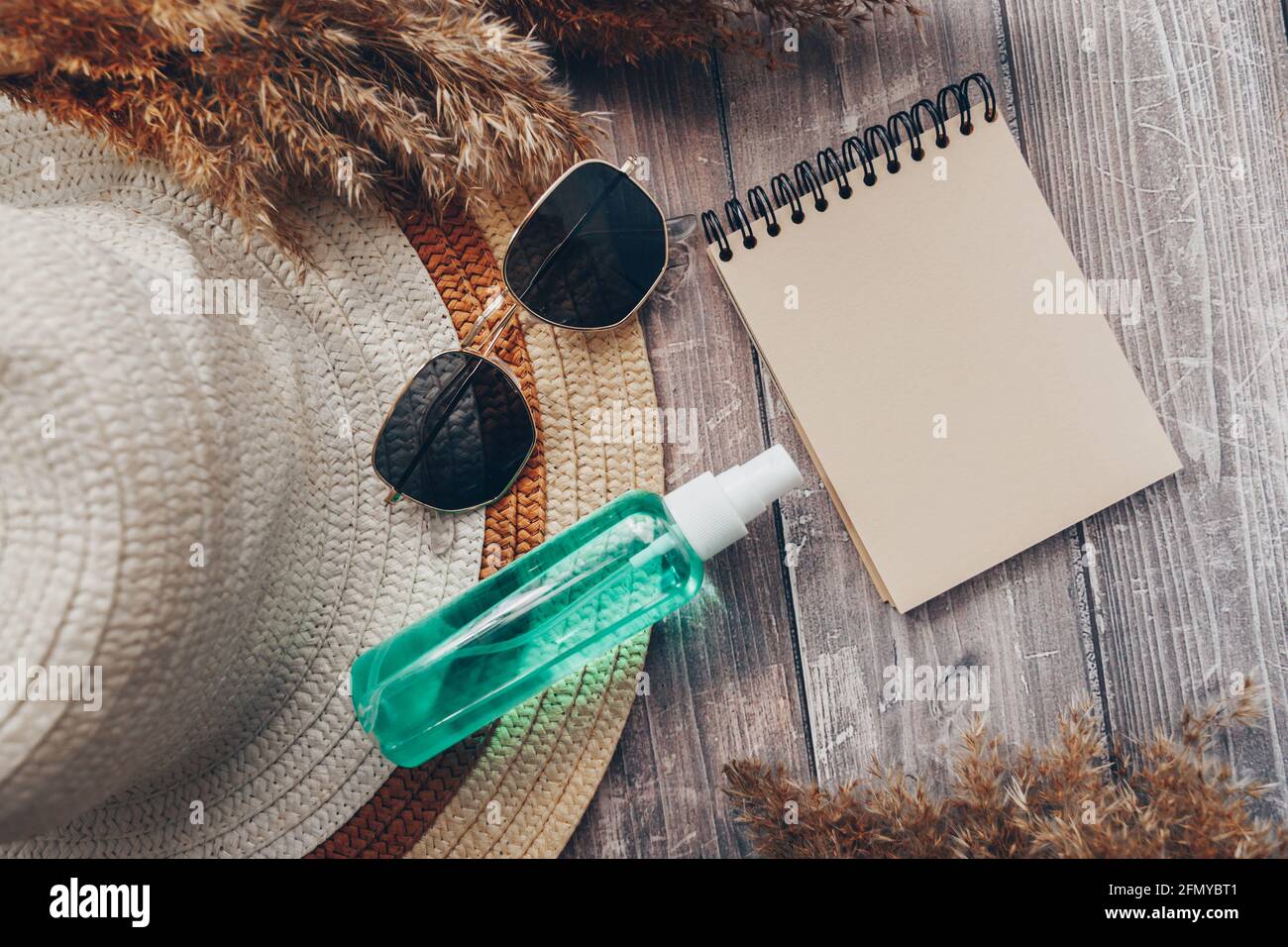 summer hat, glasses and suntan lotion. summer and tourism concept