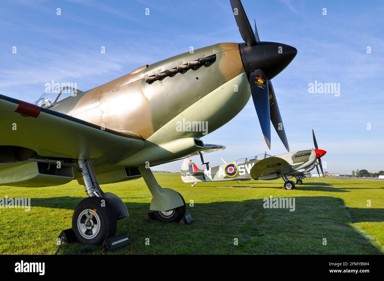 Second World War Supermarine Spitfire fighter plane PT462 framed by PV202. Both converted to two seat trainers and used to carry passengers Stock Photo