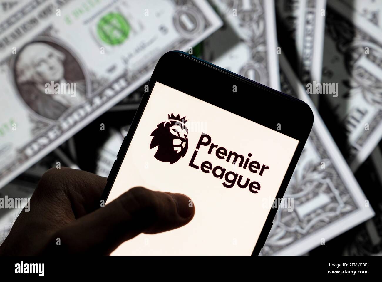 China. 23rd Apr, 2021. In this photo illustration the top level of the English football league Premier League logo seen displayed on a smartphone with USD (United States dollar) currency in the background. Credit: SOPA Images Limited/Alamy Live News Stock Photo