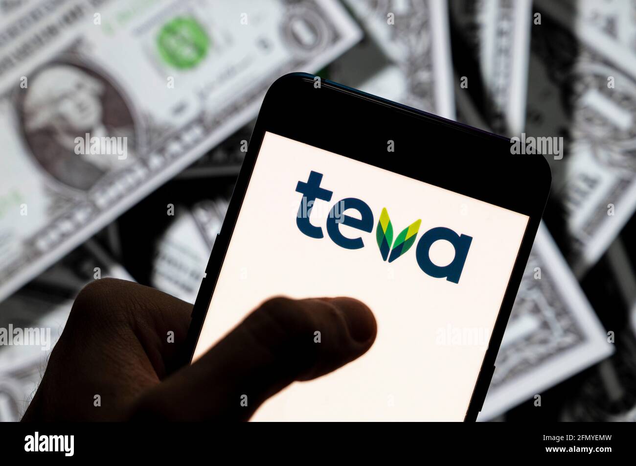 China. 21st Apr, 2021. In this photo illustration the multinational  pharmaceutical company Teva Pharmaceutical Industries logo seen displayed  on a smartphone with USD (United States dollar) currency in the background.  Credit: Budrul