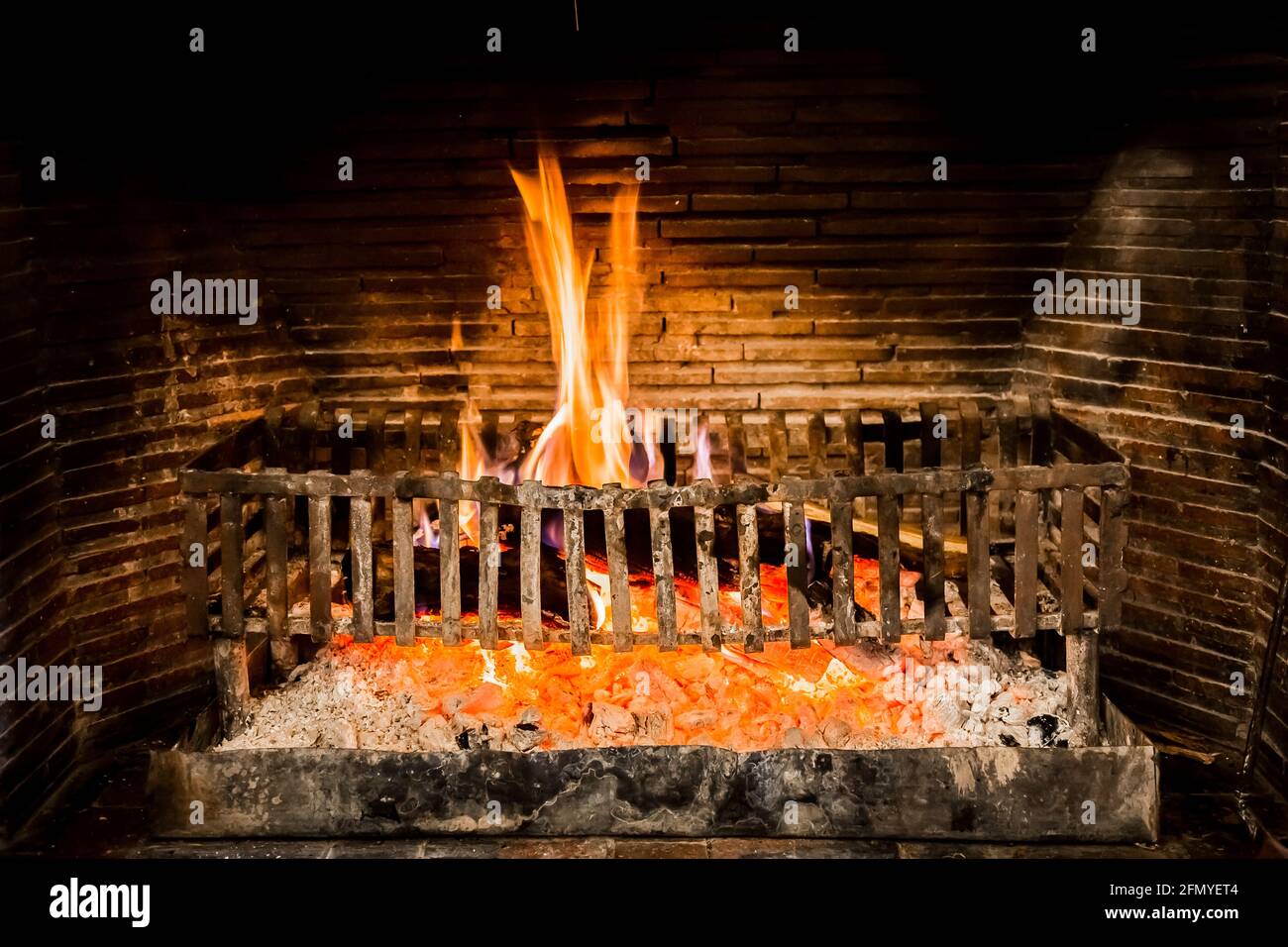 Burning logs in a Winter fireplace Stock Photo