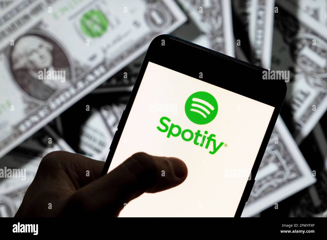 China 21st Apr 21 In This Photo Illustration The Swedish Music Streaming Platform Spotify Logo Seen Displayed On A Smartphone With Usd United States Dollar Currency In The Background Credit Budrul Chukrut Sopa