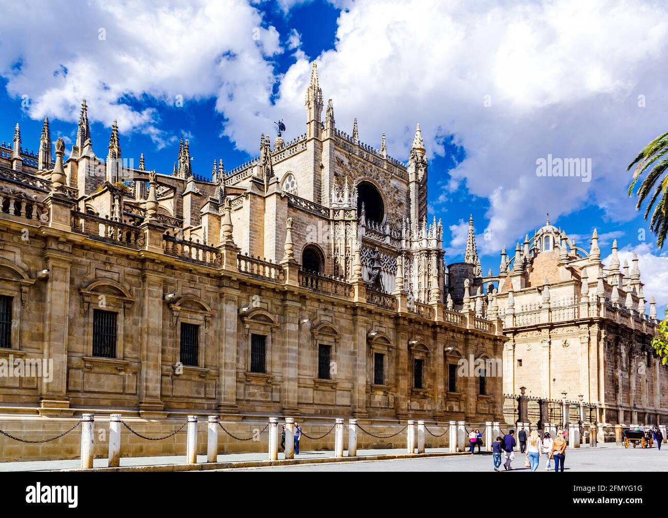 Seville, Andalusia, Spain - May 18, 2013: South facade with Prince Door Rose window towers gothic Seville Cathedral. Stock Photo