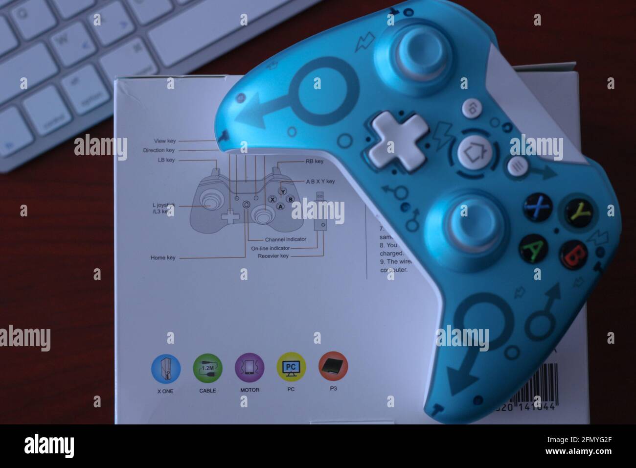 China. 30th Apr, 2021. In this photo illustration, a generic controller for  Microsoft Xbox 360 game system is displayed on its original box with a  keyboard in the background. (Photo by Thibaud