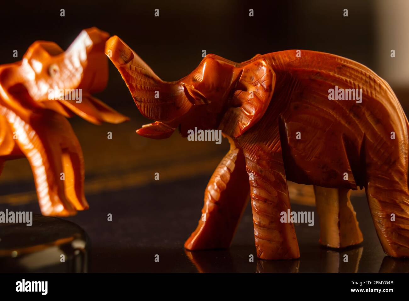 A wooden elephant miniature art with its raised trunk,African crafts