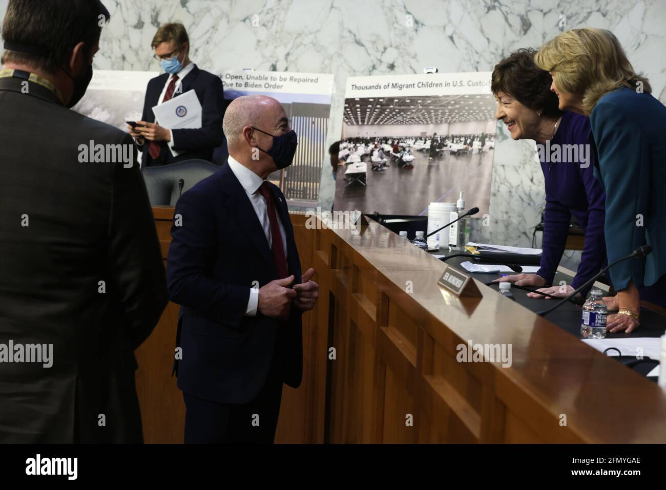 Washington, USA. 12th May, 2021. WASHINGTON, DC - MAY 12: U.S. Homeland Security Secretary Alejandro Mayorkas (3rd R) talks to Sen. Susan Collins (R=ME) (2nd R) and Sen. Lisa Murkowski (R-AK) (R) during a break of a hearing before the Senate Appropriations Committee at Hart Senate Office Building on May 12, 2021 on Capitol Hill in Washington, DC. The committee held a hearing on “Domestic Violent Extremism in America.” (Photo by Alex Wong/Pool/Sipa USA) Credit: Sipa USA/Alamy Live News Stock Photo