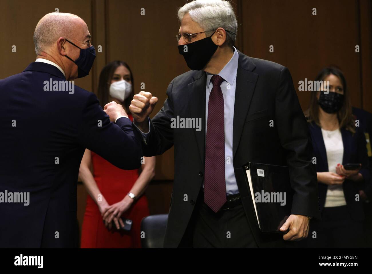 Washington, USA. 12th May, 2021. WASHINGTON, DC - MAY 12: U.S. Attorney General Merrick Garland (L) greets Homeland Security Secretary Alejandro Mayorkas (R) prior to a hearing before the Senate Appropriations Committee at Hart Senate Office Building on May 12, 2021 on Capitol Hill in Washington, DC. The committee held a hearing on “Domestic Violent Extremism in America.” (Photo by Alex Wong/Pool/Sipa USA) Credit: Sipa USA/Alamy Live News Stock Photo