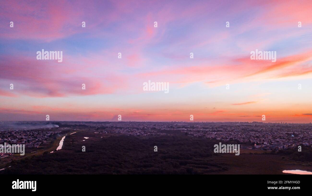 Aerial drone image of sunset with vanilla sky and clouds with pink and ...