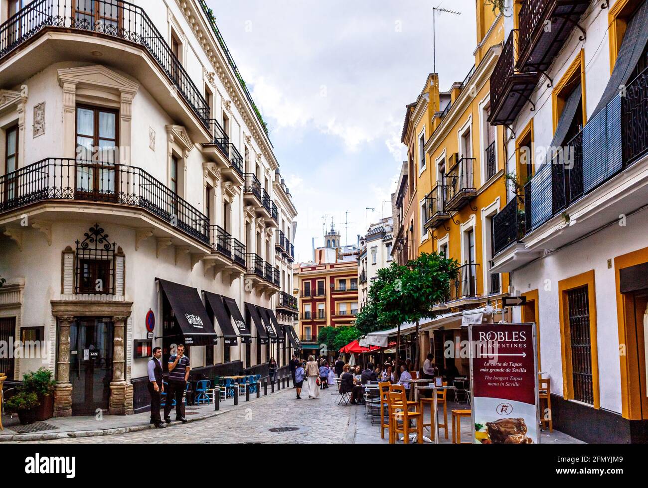 Seville, Andalusia, Spain - May 18, 2013: Romantic spanish restaurants and taverns on the street (calle) Argote de Molina. Stock Photo