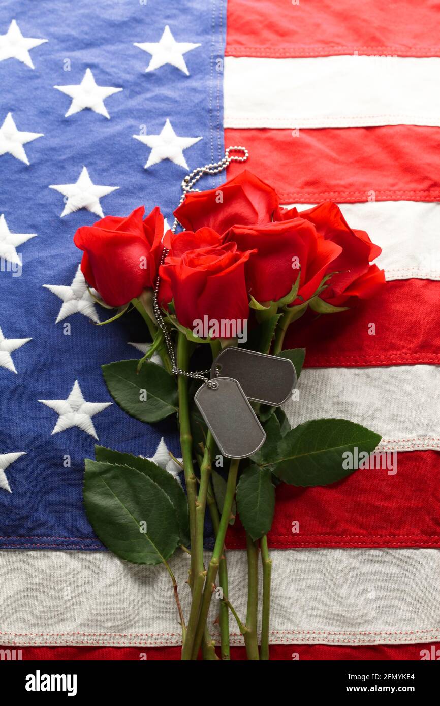 American flag with roses and blank military dog tags Stock Photo - Alamy
