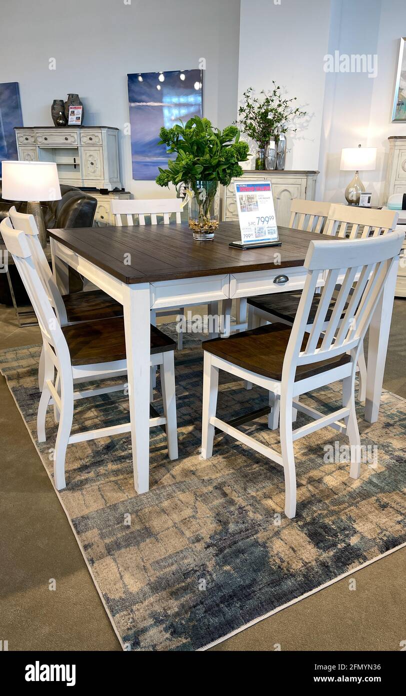 Orlando, FL USA- April 10, 2021 : A dining table and chairs at a