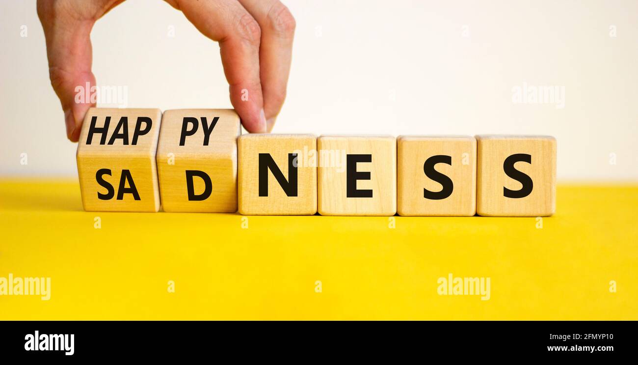 Happyness or sadness symbol. Businessman turns cubes and changes the ...