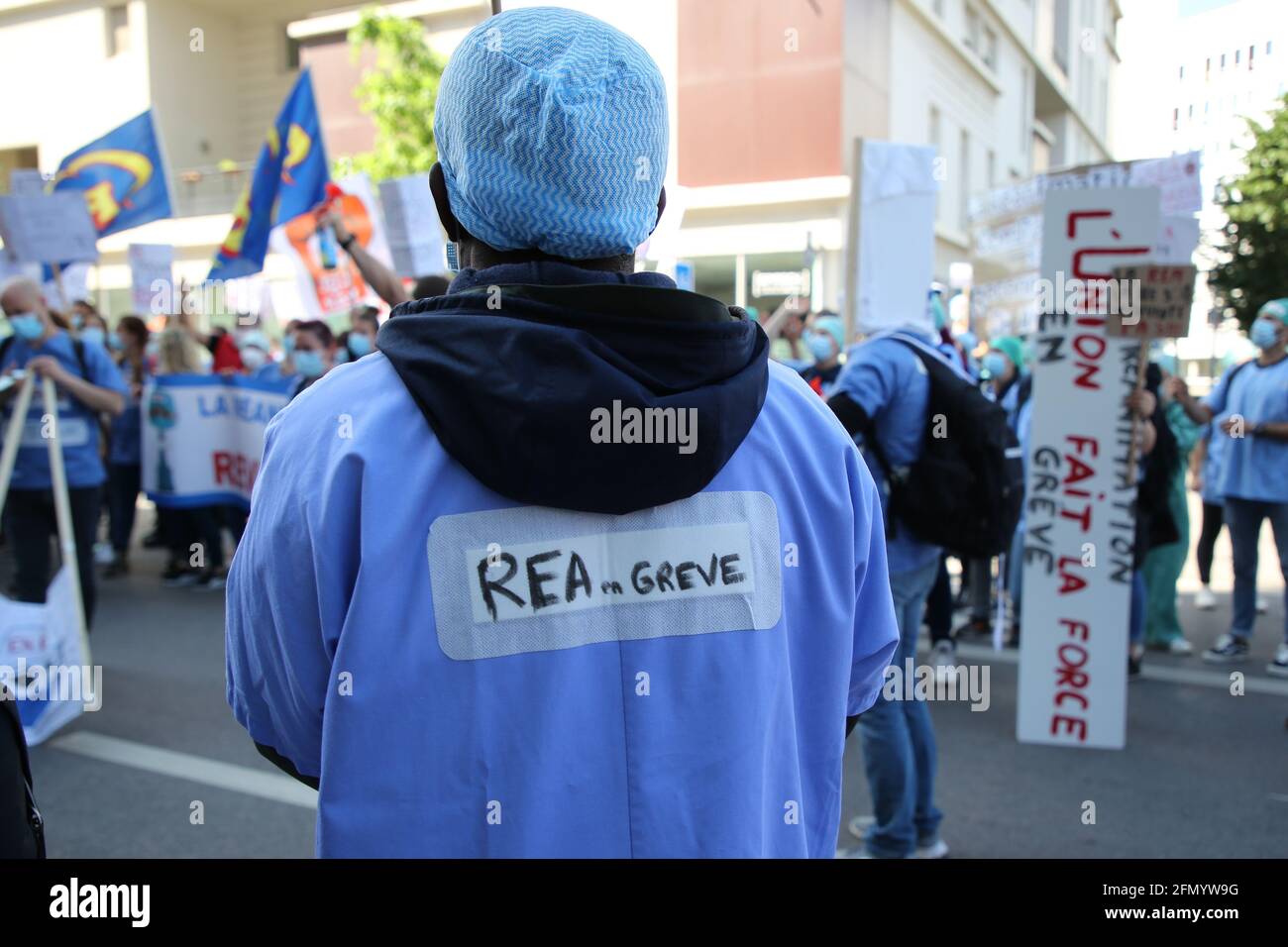 Marseille, France. 11th May, 2021. A nurse wearing a placard demanding wages during the demonstration.Nurses in intensive care have demonstrated in several cities in France to demand better working conditions and an increase in their salaries, the Covid pandemic having increased their workload. Credit: SOPA Images Limited/Alamy Live News Stock Photo