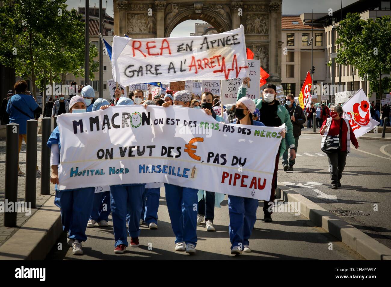 Marseille, France. 11th May, 2021. Intensive care nurses marching with banners demanding wages during the demonstration.Nurses in intensive care have demonstrated in several cities in France to demand better working conditions and an increase in their salaries, the Covid pandemic having increased their workload. Credit: SOPA Images Limited/Alamy Live News Stock Photo
