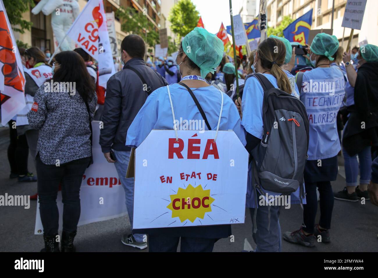 Marseille, France. 11th May, 2021. A nurse wearing a placard demanding wages during the demonstration.Nurses in intensive care have demonstrated in several cities in France to demand better working conditions and an increase in their salaries, the Covid pandemic having increased their workload. Credit: SOPA Images Limited/Alamy Live News Stock Photo