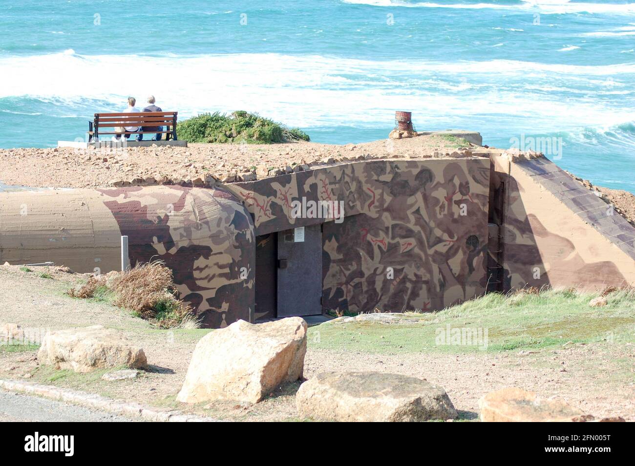 German war bunker and Tunnels with persons sitting on a seat high on ...