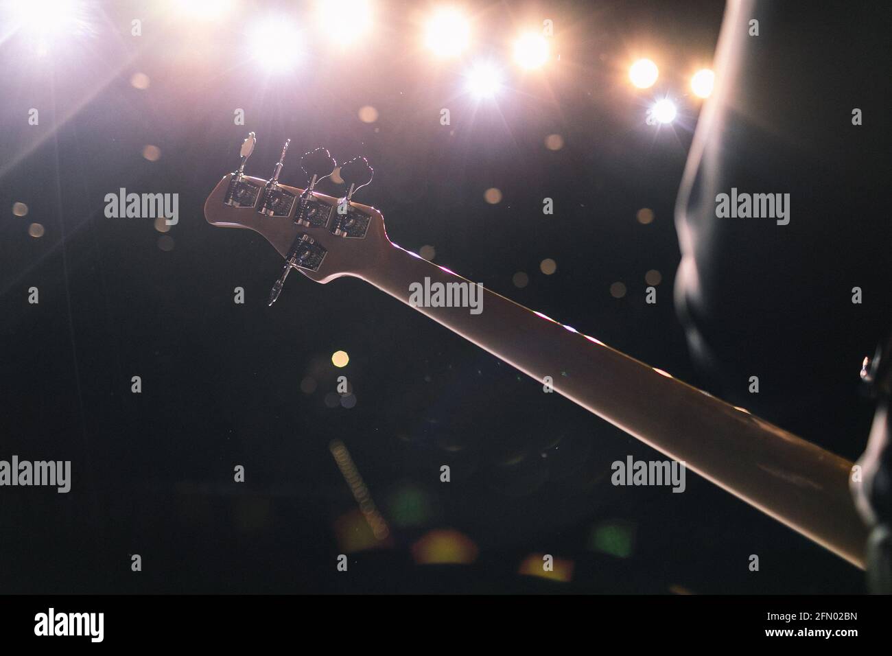 The artist plays the guitar. Rock band at a concert Stock Photo