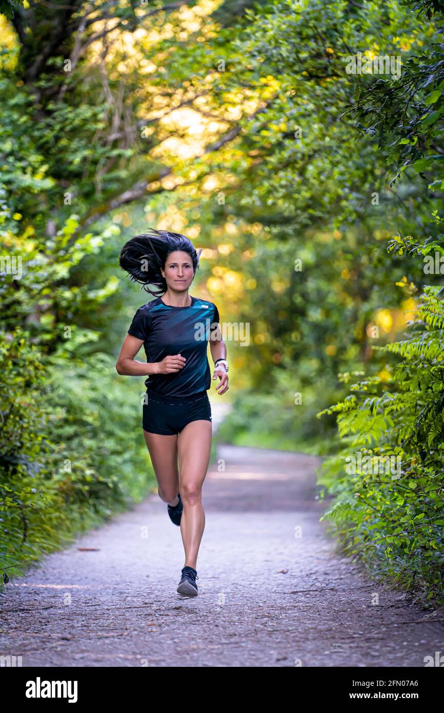 Girl running in nature, it and free lifestyle Stock Photo - Alamy