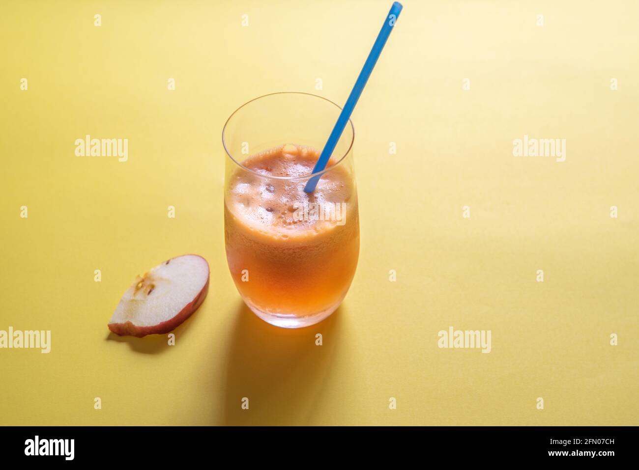 Antioxidant juice of red apple, green apple, pear, and carrot. Stock Photo