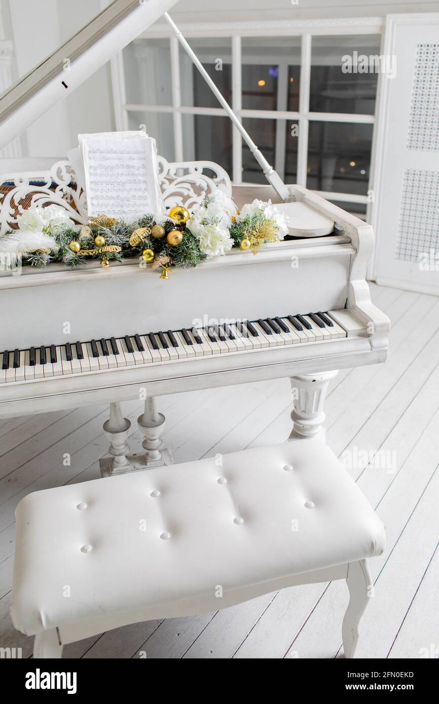white piano in a white interior. Luxury interior Stock Photo - Alamy