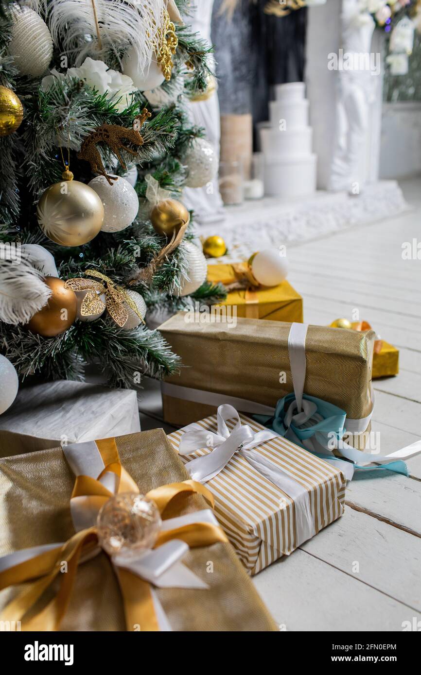 Decorated gift boxes under the Christmas tree Stock Photo