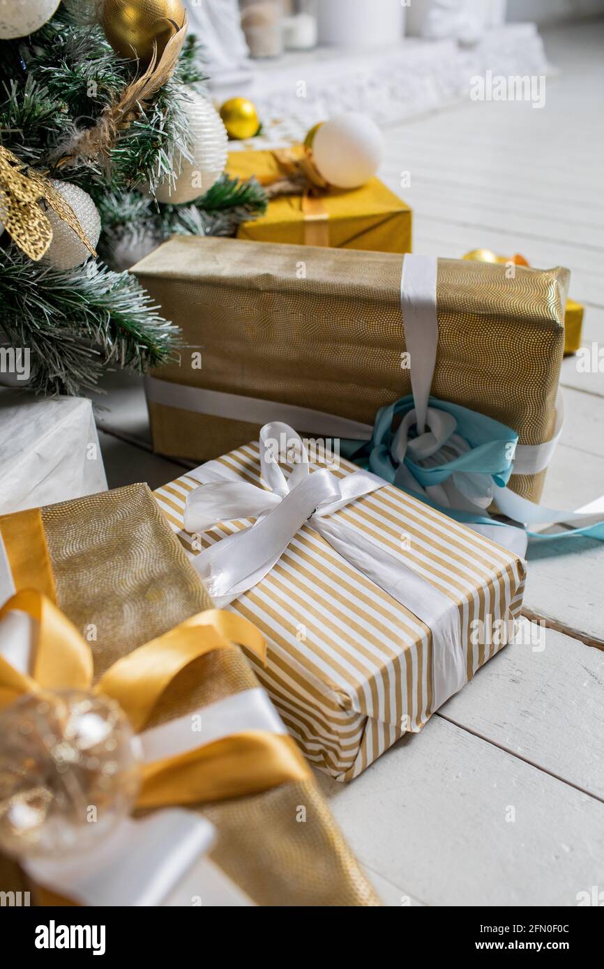Decorated gift boxes under the Christmas tree Stock Photo