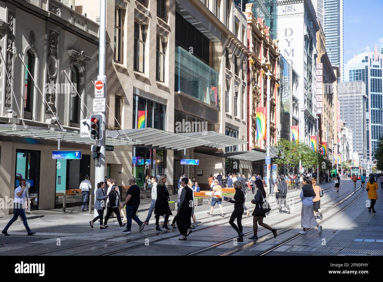 Sydney city centre office workers crossing George street at lunchtime in the city centre,NSW,Australia Stock Photo