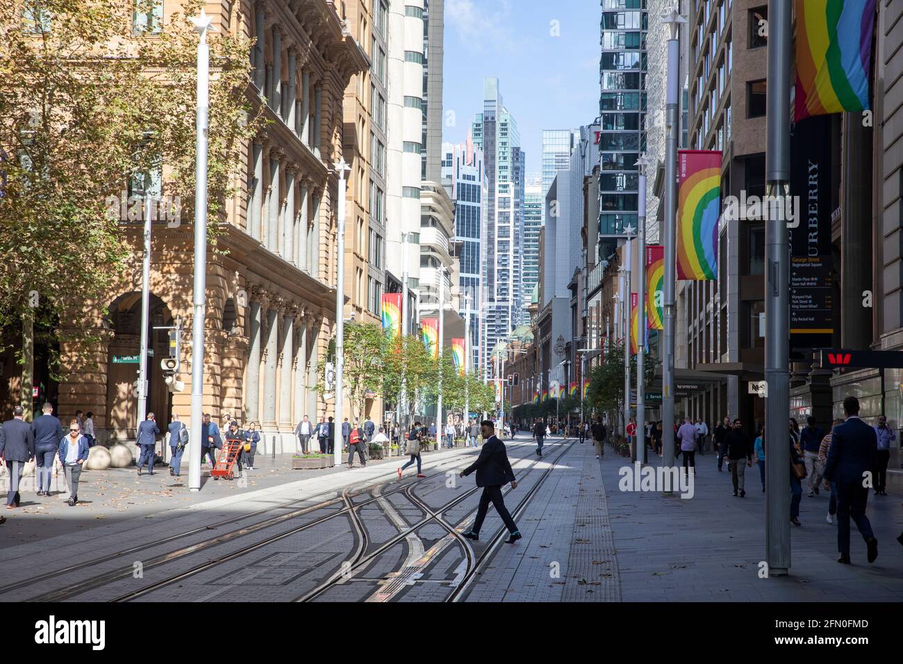 Sydney city centre view along George street with rainbow flags flying,Sydney,Australia Stock Photo
