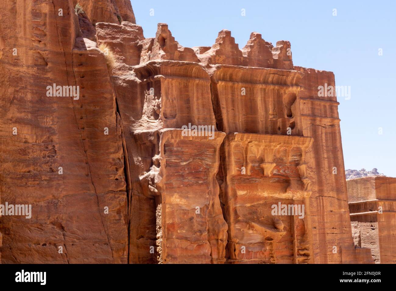 Hegra Tomb BD 70 with sets of five steps, mouldings, attic above classical entablature, supported by pilasters, Street of Facades, Petra, Jordan Stock Photo